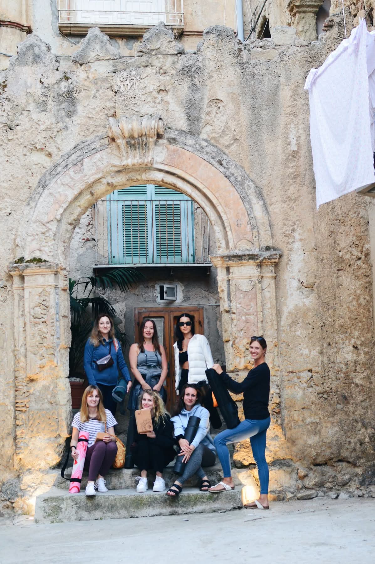 group in front of an Italian door